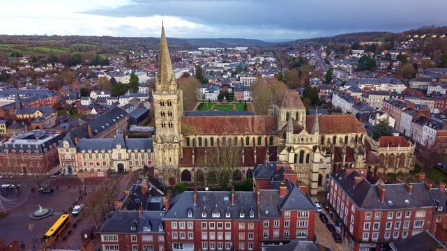 Saint-Pierre Cathedral, reveal the formal Bishop's Garden, Lisieux in Normandy, France. Aerial drone reverse