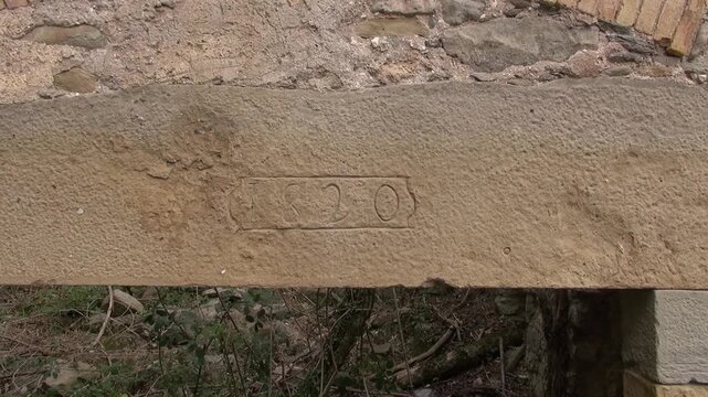 Building abandoned old stone 1820 inscription engraving year date door ruin