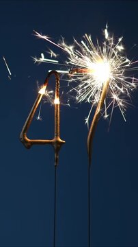 47 years celebration festive background made with Bengal fires in the form of number Forty seven. Vertical video.