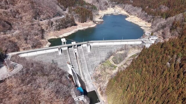 Aerial view of Kirizumi Dam in early spring, Gunma Japan mountain landscape