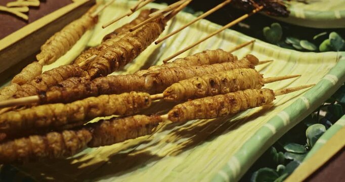 Chengdu, Sichuan, China. Fried Mealworm Larvae. Cooked Mealworm Larvae Thread On Skewers Various Cooked Insects Thread On Skewers. Crispy Insects Popular Sichuan Snack Cheap High Protein Street Food
