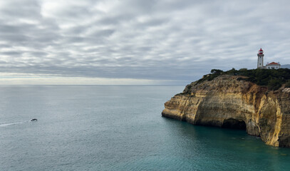 Beautiful Alfanzina Lighthouse in the coastal area of Carvoeiro, Algarve - Portugal