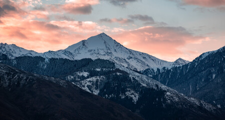 Dramatic Mountain Landscape with Fiery Sunrise Light and Deep Shadows, Soviet Peak, Satpayev Peak,...