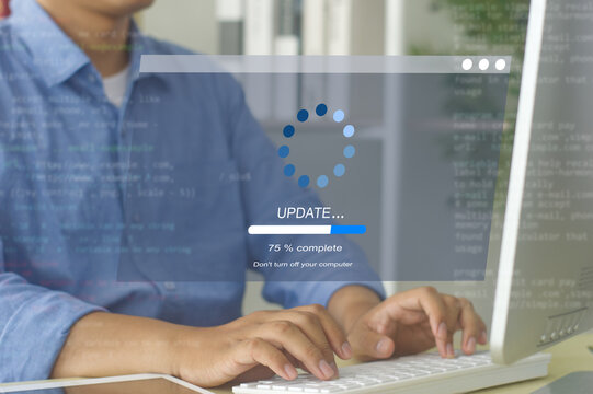 A business person updates software, installs an update process, and upgrades the software version concept. Software updates or operating system upgrades
