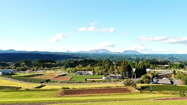 晴天の阿蘇五岳と田園風景のパノラマ
 「阿蘇を飲み干す、天空のワイナリー。五ヶ瀬から眺める、世界最大級の涅槃像（ねはんぞう）。」
宮崎県五ヶ瀬町 (五ヶ瀬ワイナリー展望台)
"A winery in the sky that drinks up Aso. See one of the world's largest reclining Buddha statues from Gokase."