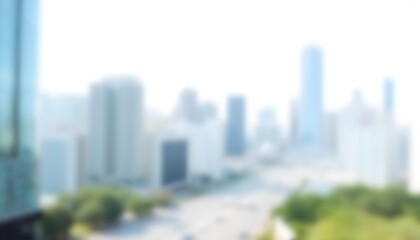 Fototapeta premium Blurred cityscape with skyscrapers and greenery in foreground showing urban landscape