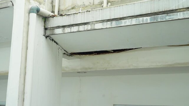 Structural Concrete Ceiling Damage and Water Seepage in Building Exterior