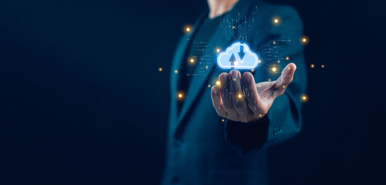 Businessman holding glowing cloud computing interface with data network icons cybersecurity analytics and connectivity concept for cloud technology digital transformation data storage SaaS services