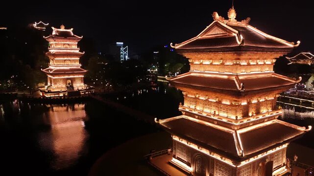 Illuminated ancient buddhist pagodas at night in hoa lu, ninh binh, vietnam a aerial view