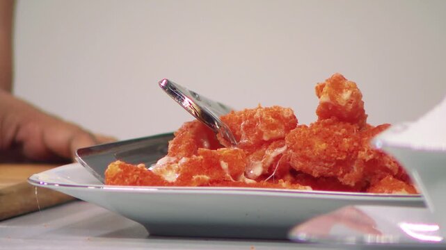 Fried Mozzarella Lifted with Tongs