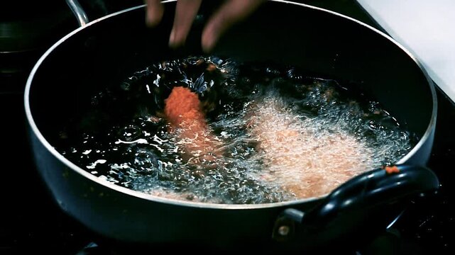 Mozzarella Stick Dropping into Hot Oil
