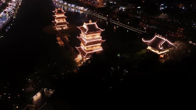 Aerial view of illuminated pagodas at night in hoa lu ancient town, ninh binh, vietnam