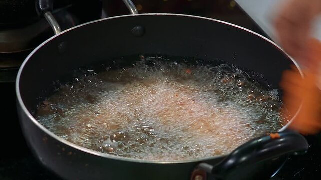 Mozzarella Sticks Frying in Hot Oil