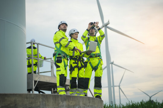 Wind turbine inspection action by engineers in renewable energy industry industrial environment professional viewpoint