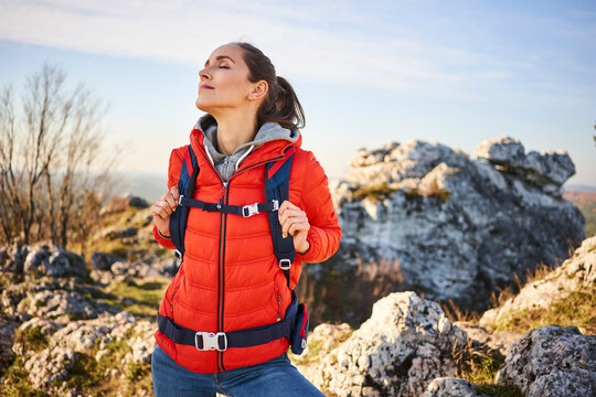 Woman on a hiking trip in the mountains having a break
