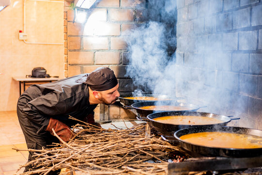 Traditional cooking of paella in restaurant kitchen