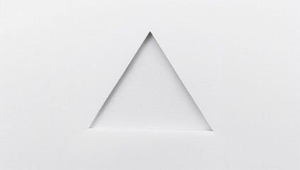Displaying white paper with triangle cutout forming bevel edges and inner shadows on studio table