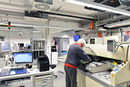 Man working on the manufacturing of circuit boards for the electronics industry