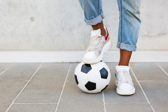 Man's feet with soccer ball