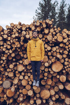 Young man standing on a stck of wood, giving the illusion of hovering