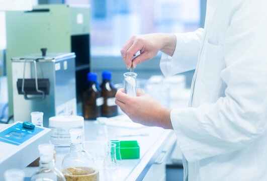 Lab technician experimenting in lab