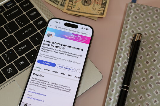 Kiel, Germany - 03-06-2026: German cybersecurity authority Federal Office for Information Security (BSI) Profile on LinkedIn Displayed on a Smartphone ontop of Laptop