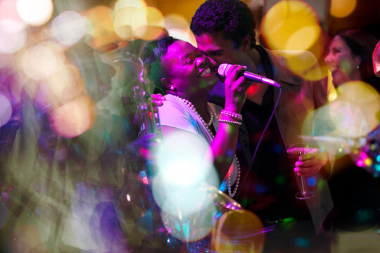 Man embracing singer on a party