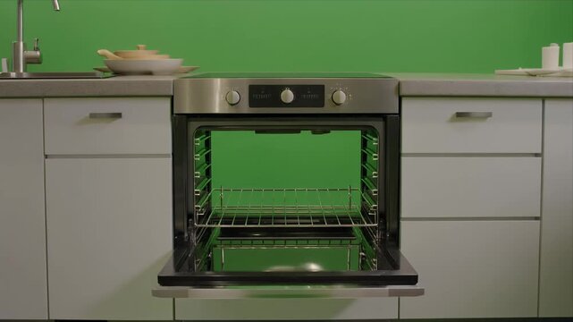 Modern stainless steel kitchen oven door opening front view.