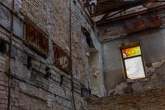 Irpin, Ukraine - 07 March 2026: View of the skeletal remains of a building on Universitetska Street, its brick walls scarred and weathered, a testament to time and conflict.