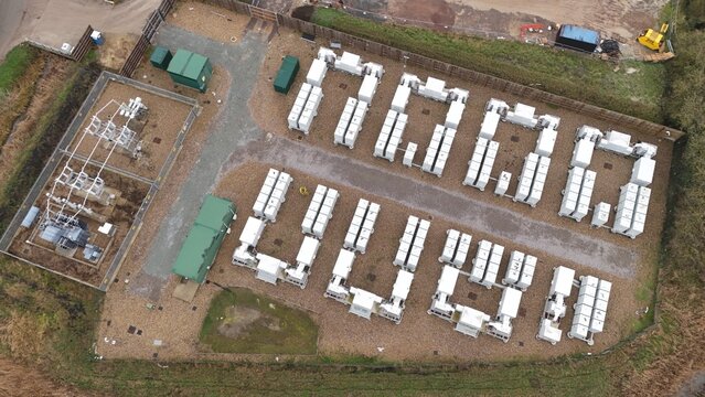 Aerial view of a modern electrical substation with battery energy storage systems, a testament to renewable energy integration, Burwell, United Kingdom.