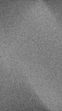 Textured gray background with subtle light streaks and grain pattern design, soft gradient illumination creating atmospheric surface, abstract background motion graphic.
