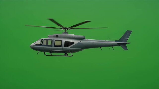 Sleek gray helicopter hovering on green screen side view.