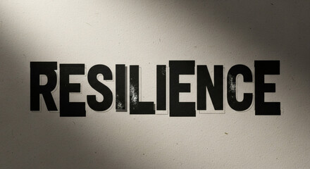 Obraz premium Resilience Concept with Stencil Text on Wall