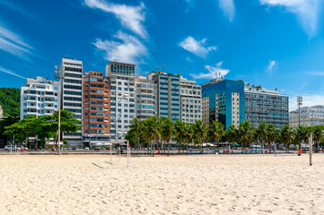 Copacabana beach and Avenida Atlantica in Rio de Janeiro, Brazil. Copacabana beach is the most famous beach in Rio de Janeiro. Sunny cityscape of Rio de Janeiro