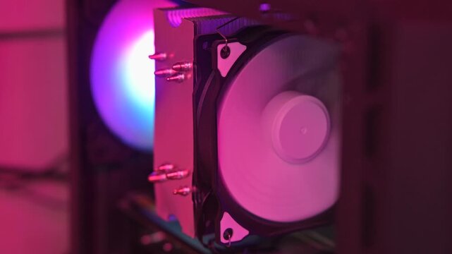 Cooling fan displays dynamic RGB lighting while providing airflow for electronic devices.