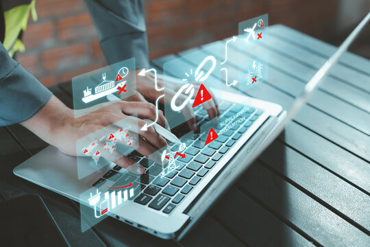 Business analyst using laptop with virtual supply chain disruption, cancelled shipping, oil crisis dashboard for Middle East geopolitical conflict concept, global economic impact of USA Iran Israel