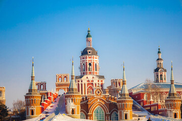 Obraz premium The bright red castle contrasts beautifully with the blue sky at Volga manor, Harbin, China.