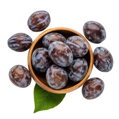 Obraz premium A small wooden bowl filled with speckled brown plum like fruits and a single green leaf on transparent background