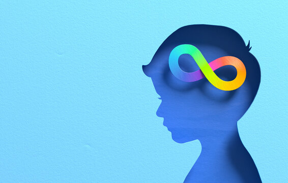 Blue child head silhouette with colorful rainbow infinity symbol representing neurodiversity, autism, cognitive diversity and inclusive mental health awareness in paper cut 3D illustration