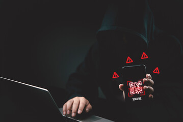 Anonymous hacker holding smartphone with malicious QR code scam and warning signs. Cyber security,...