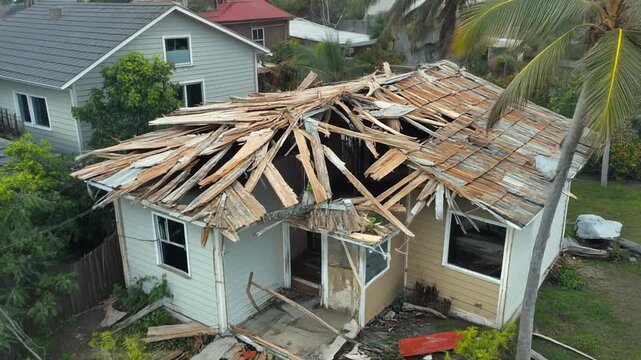 Aerial View Of Abandoned House With Destroyed Roof After Severe Hurricane Devastation