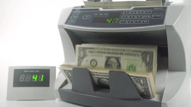 Machine For Counting And Checking The Authenticity Of Dollar Bills.