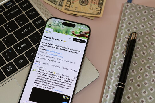 Kiel, Germany - 03-10-2026: X (Twitter) Profile of Indian oil company Bharat Petroleum displayed on smartphone lying on a laptop keyboard
