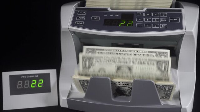 Machine For Counting And Checking The Authenticity Of Dollar Bills.