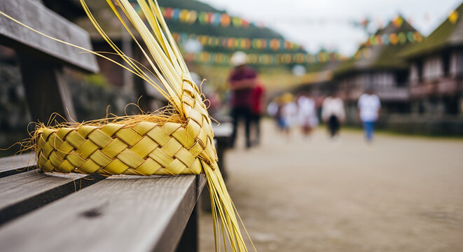 Batanes Vakul Festival, a hand-woven Vakul headgear resting on a rustic wooden bench, highlighting the organic yellow-gold palm leaf weaving and fibrous details