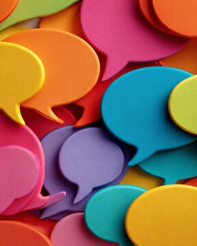 Vibrant rainbow colored speech bubbles overlapping, symbolizing inclusive dialogue and diverse communication among individuals.