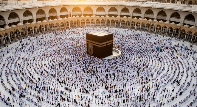 Hajj Pilgrimage Kaaba, aerial view of the Mataf area during golden hour, thousands of pilgrims in white Ihram forming concentric circles around the black Kaaba 