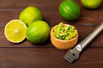 Fresh lime zest isolated on white background. Lime zest or peel close-up. Grated citrus peel. Lime...