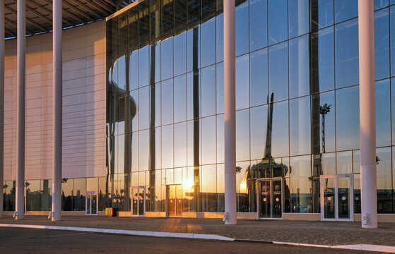 Reflection of Buran space shuttle model in a glass facade of Science University. Sirius. Russia