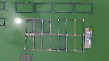 aquaculture framework, floating fish ponds with green water holding with solar panel © faiz